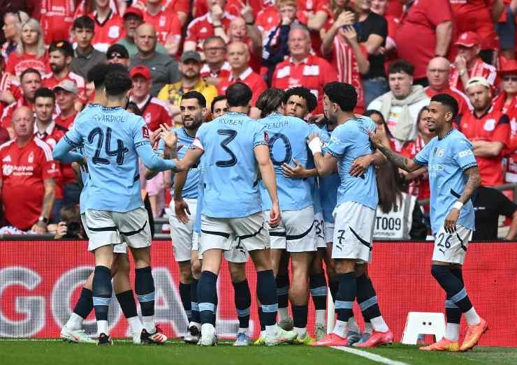 Giocatori del Manchester City esultano